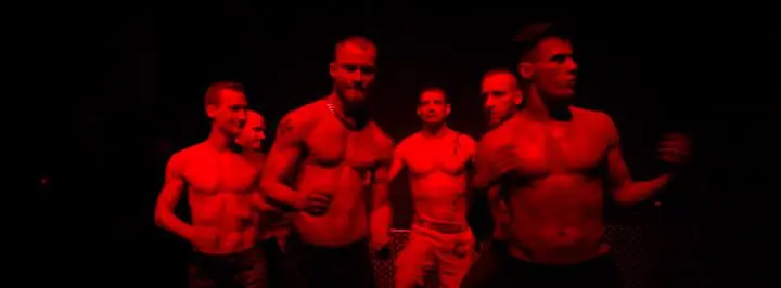 videostill from the movie hyper masculinity on the dancefloor -  fit shirtless men dancing
